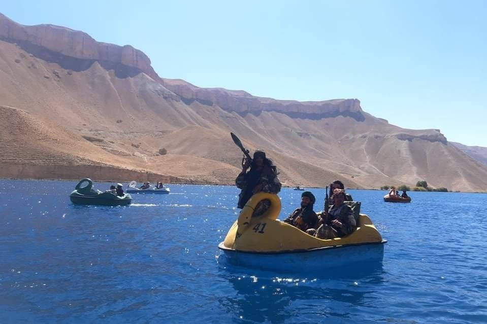 Heavily-armed Taliban Fighters on a leisurely boat ride. Source: The National UAE